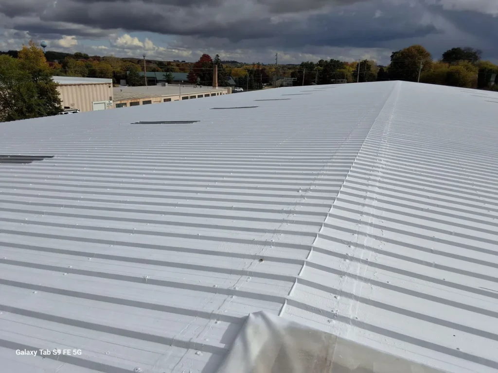 Freshly coated white metal roof on commercial building
