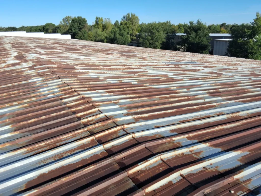 Heavily rusted corrugated metal roof needing replacement